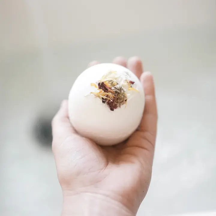 Close-up of lavender bath bomb, highlighting its natural ingredients and soothing appearance.