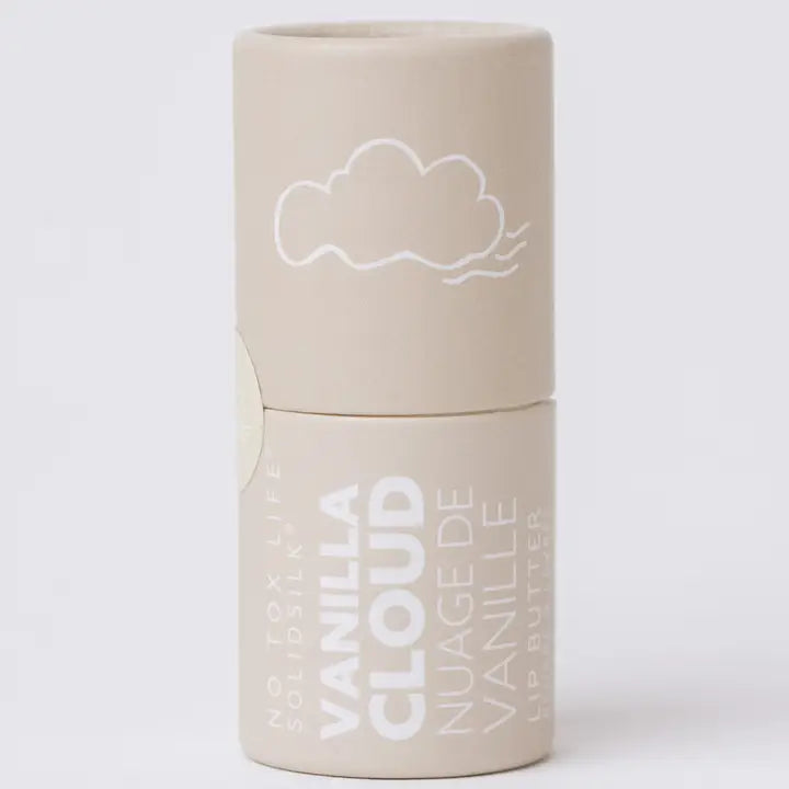 Beige paperboard tube labeled 'NO TOX LIFE SOLIDSILK VANILLA CLOUD NUAGE DE VANILLE LIP BUTTER' with a white cloud illustration, standing upright on a white background.