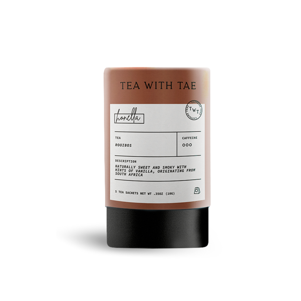 Brown cylindrical tea packaging labeled 'TEA WITH TAE' and 'honella', with text describing 'Rooibos' tea as 'naturally sweet and smoky with hints of vanilla', on a white background.